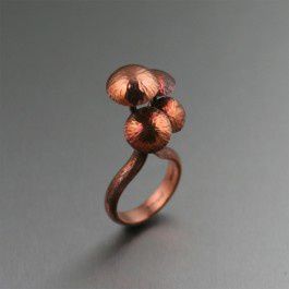 Shiitake Mushroom Copper Ring - Accent your jewelry collection with a look that's made beautiful by nature. This handmade Shiitake Mushroom Copper Ring ring showcases four Shiitake Mushrooms sprouting forth from a tree bark texturized ring shank that is simply enchanting.
